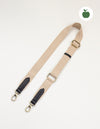 Herringbone webbing strap in Sand & Black Apple Leather details. Front product image.