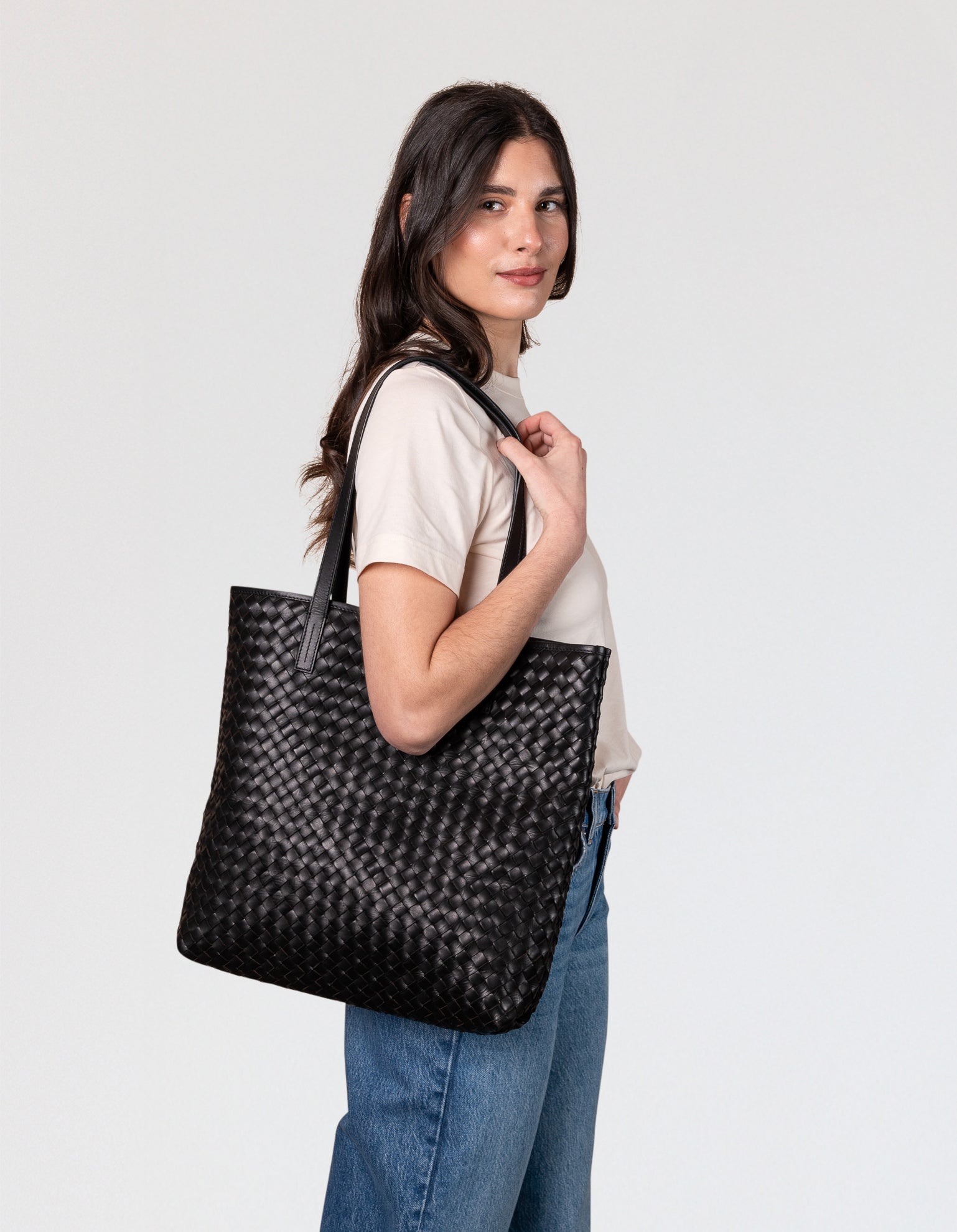 Model with Georgia bag in black woven classic leather