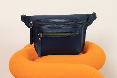 Product photo of blue bag on green table