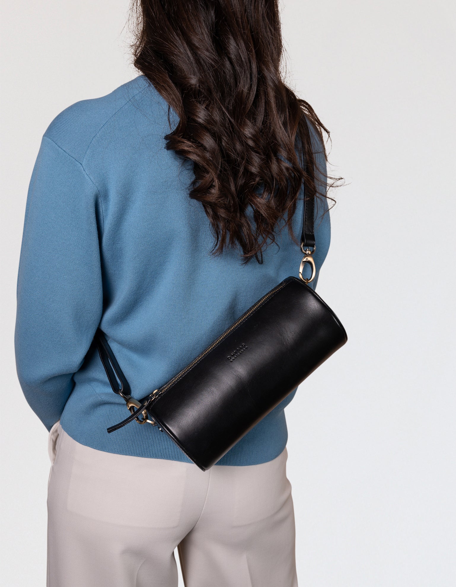 Model with Izzy bag in black classic leather