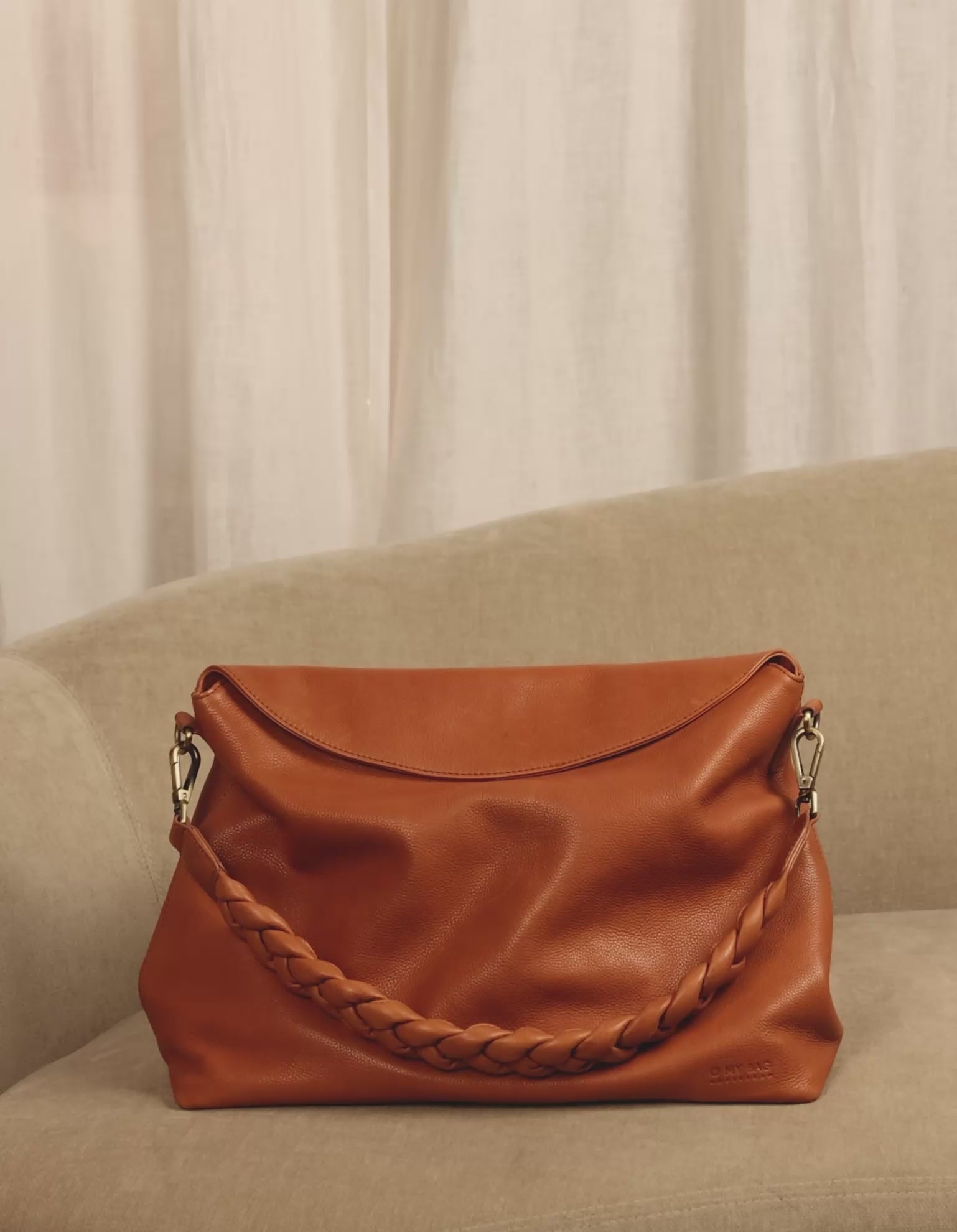 Inside bag video of Sienna wild oak soft grain leather crossbody work bag with braided shoulder strap