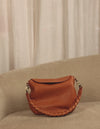 Inside bag video of Lana wild oak soft grain leather crossbody bag with braided shoulder strap