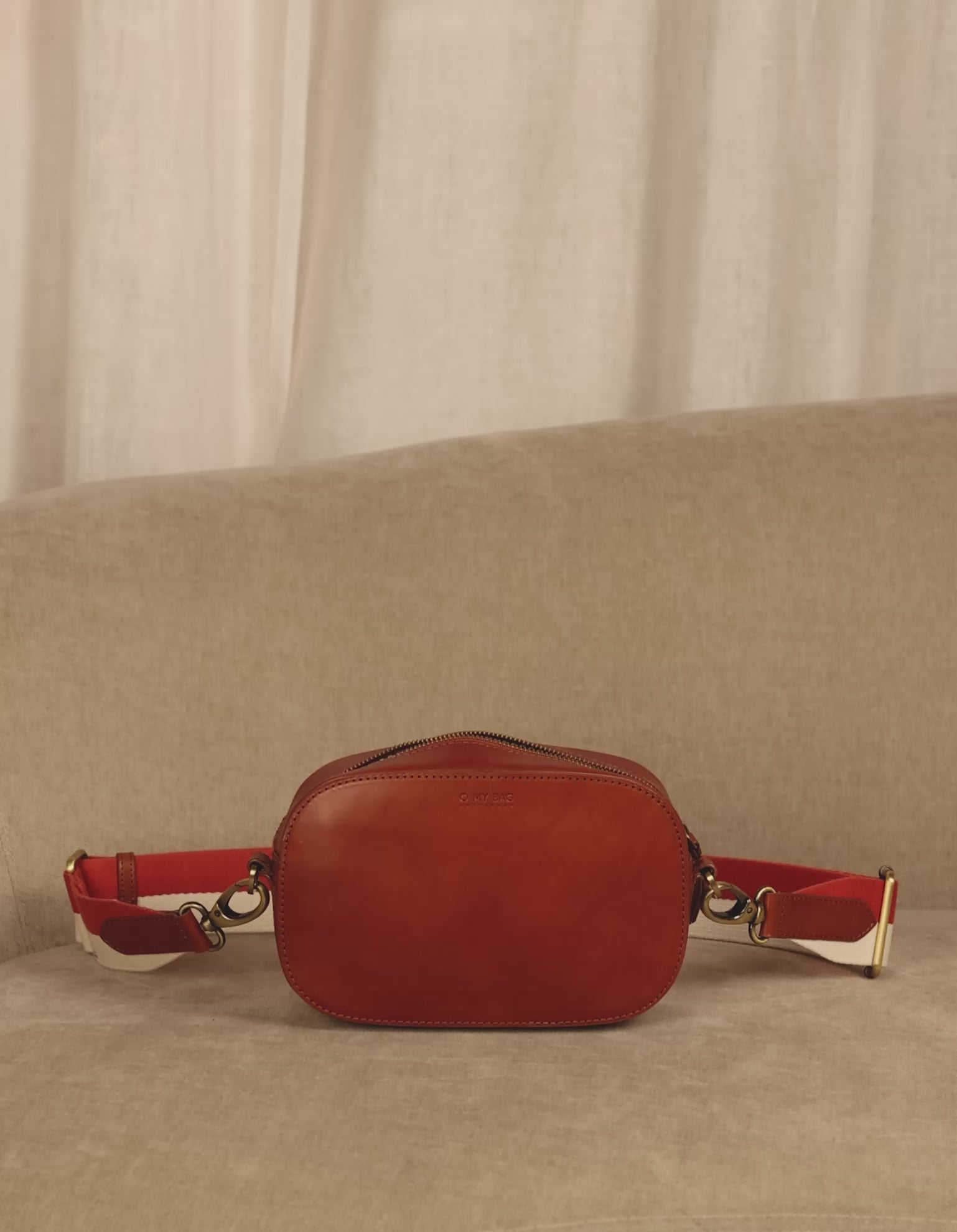 Inside bag video of Maya cognac classic leather crossbody bag with adjustable leather strap