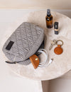 lifestyle image cord taco, bella pouch and keychain