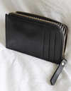 Lola Coin Purse Black Classic Leather. Model image