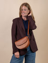 Ava in Cognac Classic Leather. Model Image with leather strap.