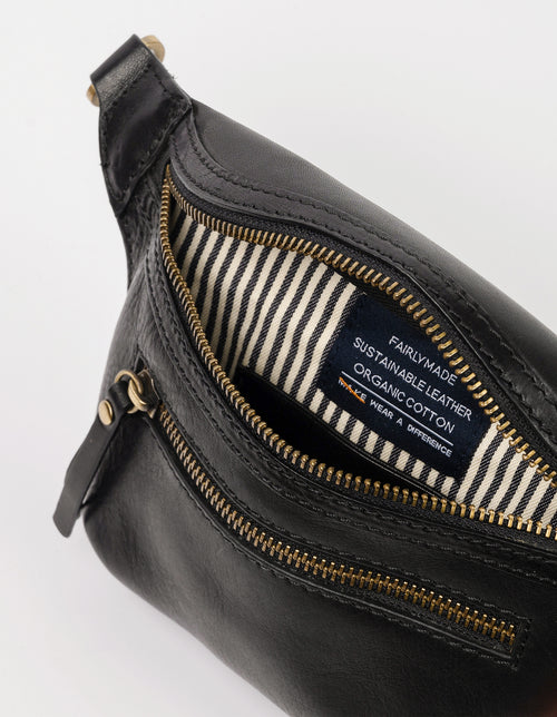 Black Leather womens fanny pack. Square shape with an adjustable strap. Inside product image