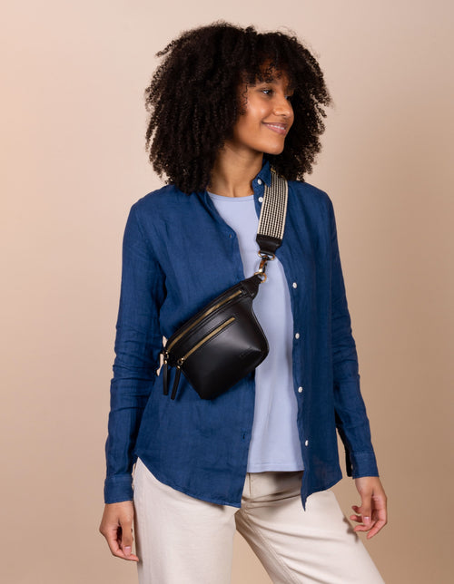 Becks Bum Bag in black apple leather - female model product image