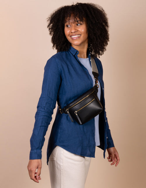 Becks Bum Bag in black apple leather - female model product image