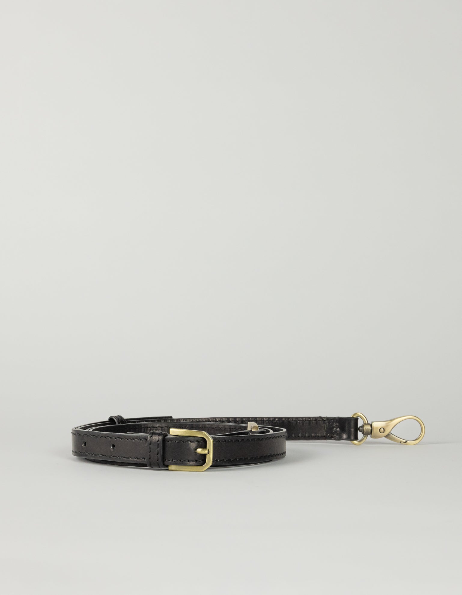 Black leather crossbody strap, rolled
