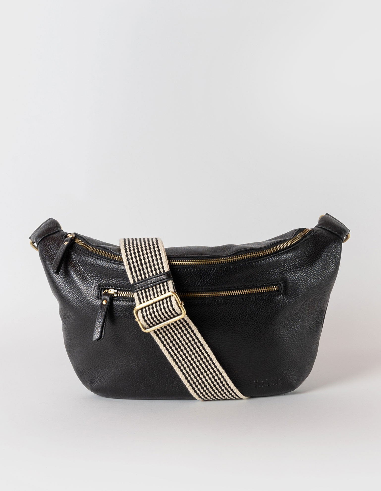 Drew Maxi in black soft grain leather with checkered webbing strap. Front product image.