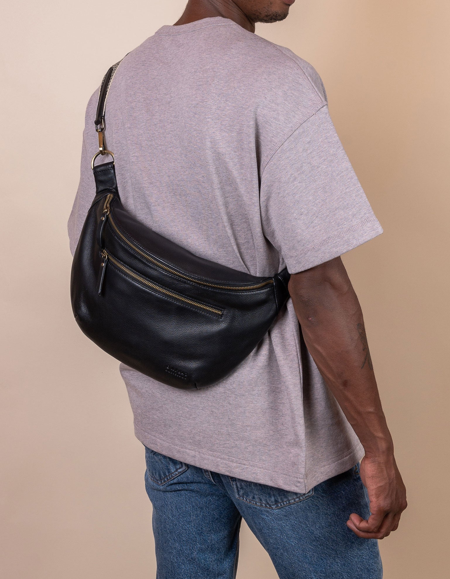Drew Maxi Bum Bag in Black Soft Grain Leather - Model Image, back view