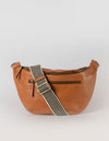 Drew Maxi in wild oak soft grain leather with checkered webbing strap. Front product image.