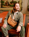 Drew Maxi in wild oak soft grain leather with adjustable leather strap - FW22 campaign model image
