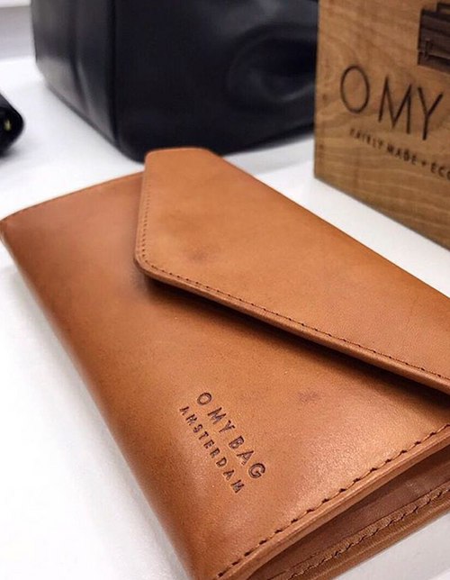 Cognac wallet. Envelope shape. Lifestyle product image.