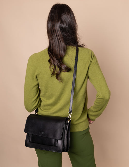 Harper Black Leather crossbody handbag. Model image