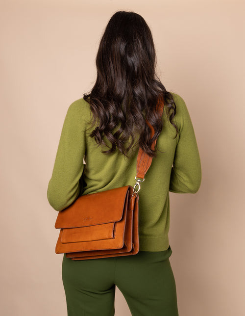 Harper Cognac Leather crossbody handbag. Product model image