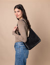 Model with Vicky bag in black classic leather