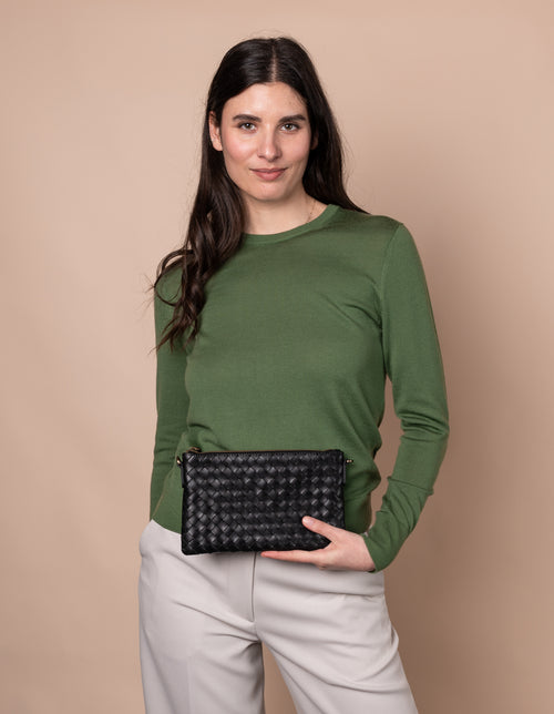 Model with Lexi bag in black woven classic leather