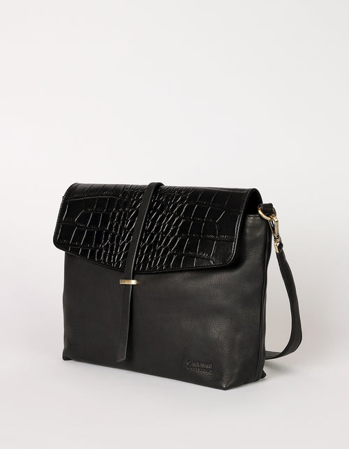Black Classic Croco leather womens handbag. Square shape with an adjustable strap. Side product image.