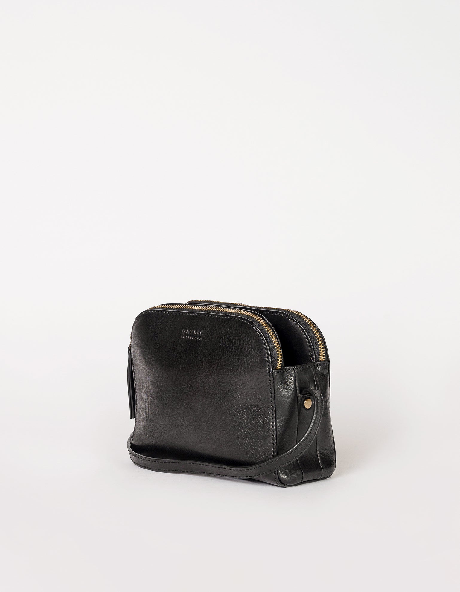 Black Leather womens handbag. Square shape with an adjustable strap. Side product image. 