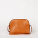 Cognac Leather womens handbag. Square shape with an adjustable strap. Front product image.