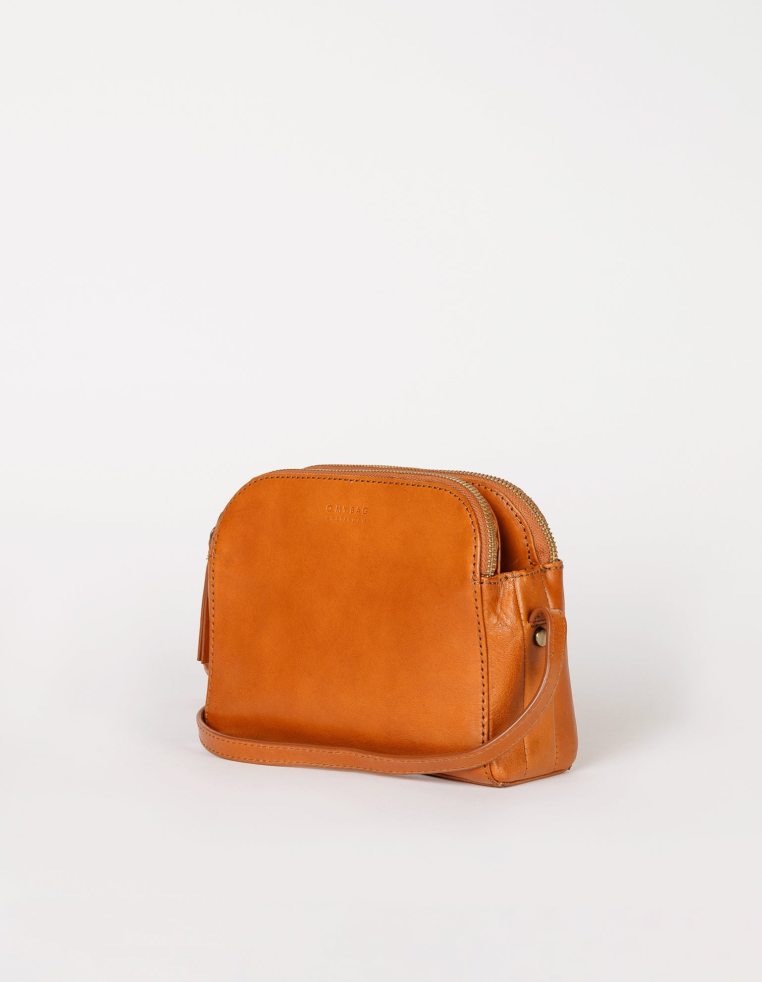 Cognac Leather womens handbag. Square shape with an adjustable strap. Side product image