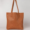 Georgia tote bag in wild oak soft grain leather. Front product image.