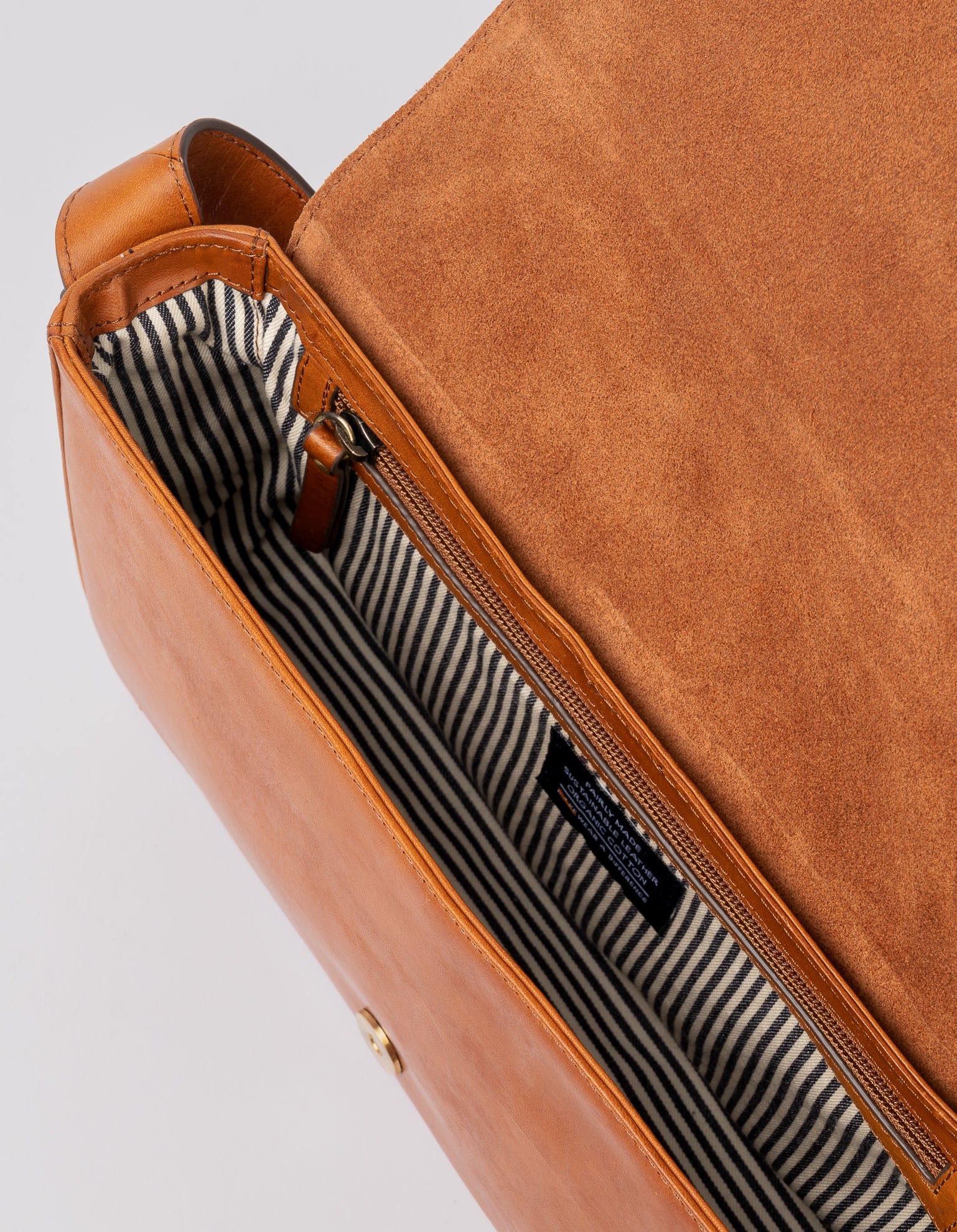 Cognac Baguette Leather womens handbag. Square shape with an adjustable strap. Inside product image.