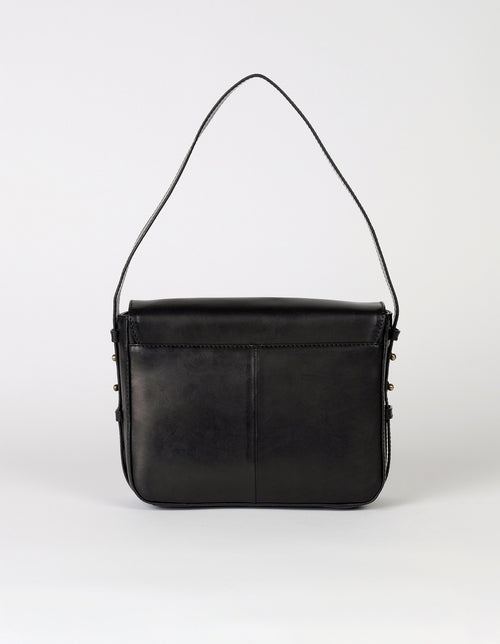 Black Leather womens handbag. Square shape with an adjustable strap. Back product image.