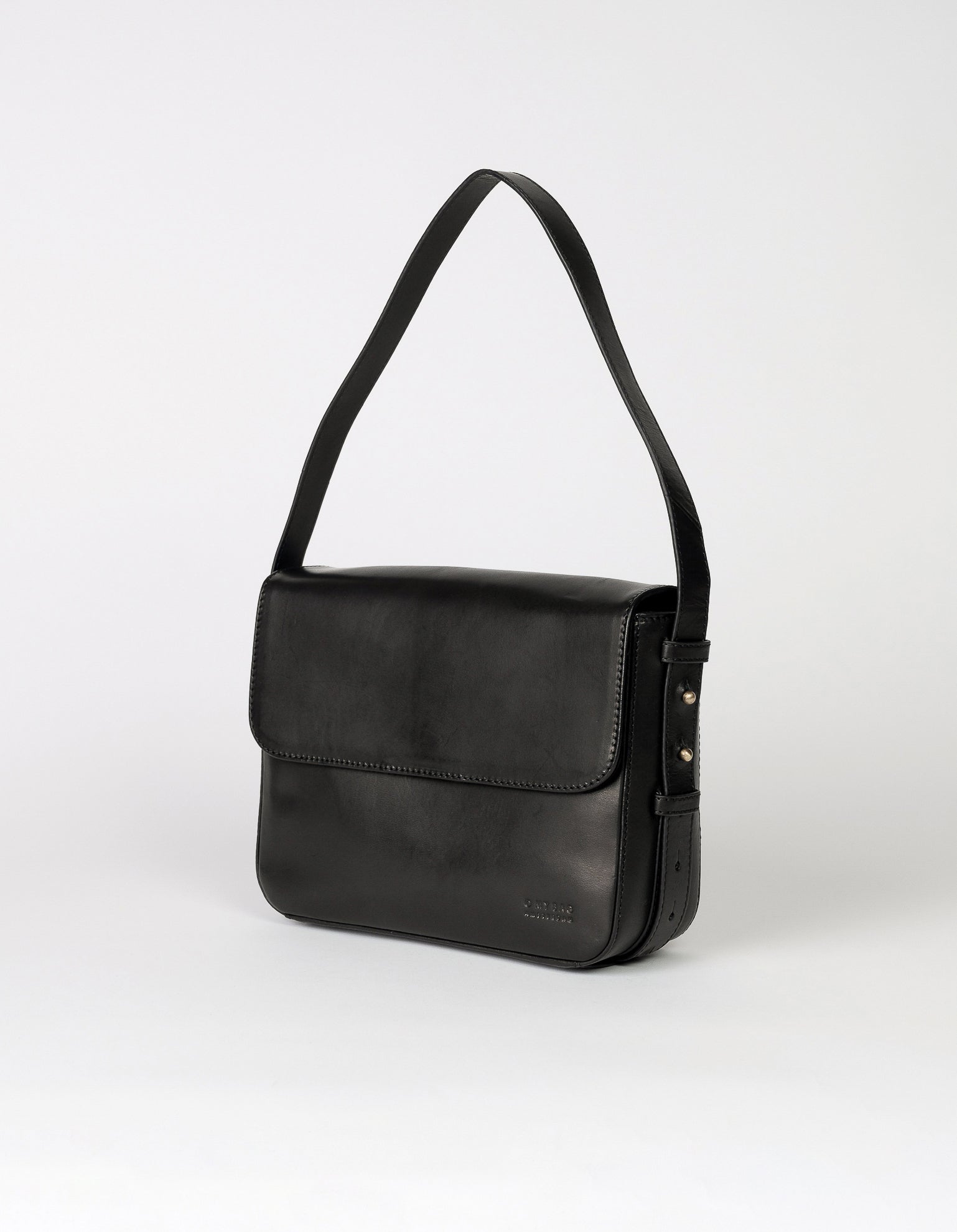Black Leather womens handbag. Square shape with an adjustable strap. Side product image.