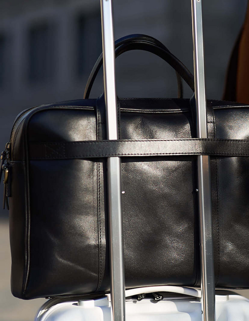 Black Leather business bag. Lifestyle product image.  