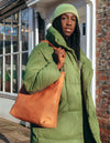 Wild Oak Leather shopper bag. Square shape with an adjustable and removable strap. Model product image.