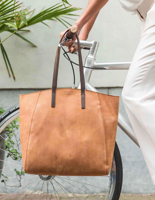 Camel Leather shopper bag. Square shape. Lifestyle product image.