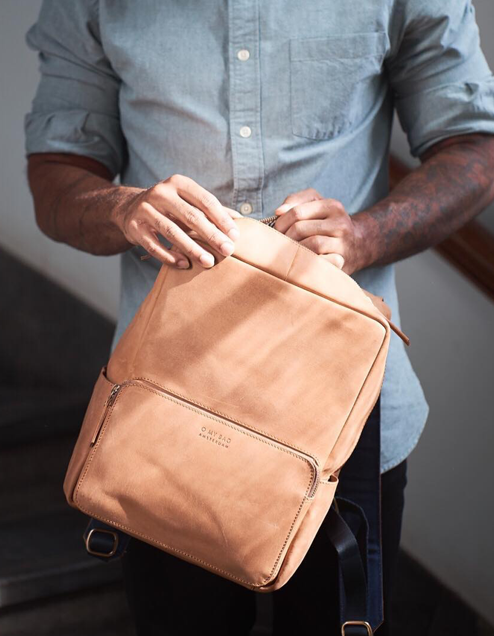 Camel Leather backpack. Lifestyle product image.
