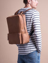 Camel Leather backpack. Model product image. 