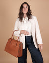 Kate Cognac Stromboli Leather Crossbody Shoulder Bag. Model image