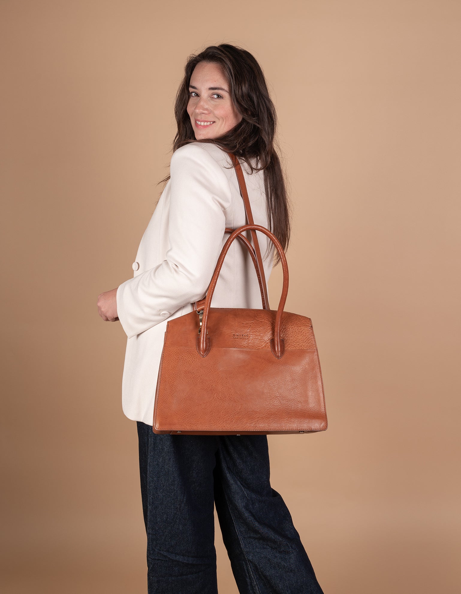 Kate Cognac Stromboli Leather Crossbody Shoulder Bag with Large Straps by O My Bag. Model image
