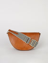 Laura Bag Cognac Classic Leather. Round moon shape crossbody bag . Front product image. With checkered webbing strap