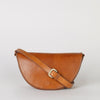 Laura Bag Cognac Classic Leather. Round moon shape crossbody bag . Front product image with full leather strap
