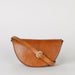Laura Bag Cognac Classic Leather. Round moon shape crossbody bag . Front product image with full leather strap