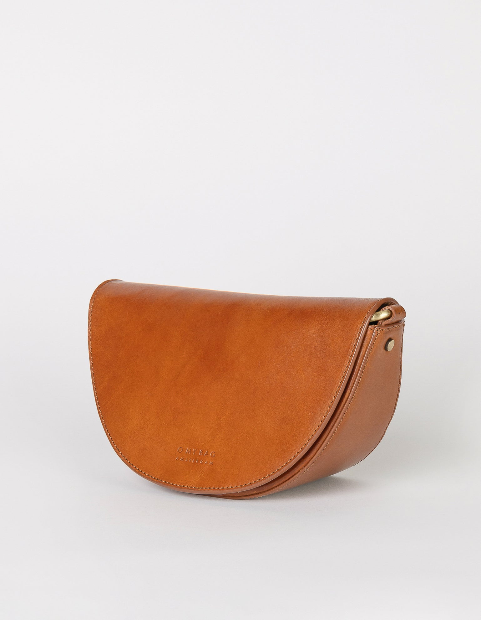 Laura Bag Cognac Classic Leather. Round moon shape crossbody bag . Side product image.