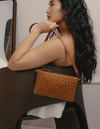 Model with Lexi bag in cognac woven classic leather