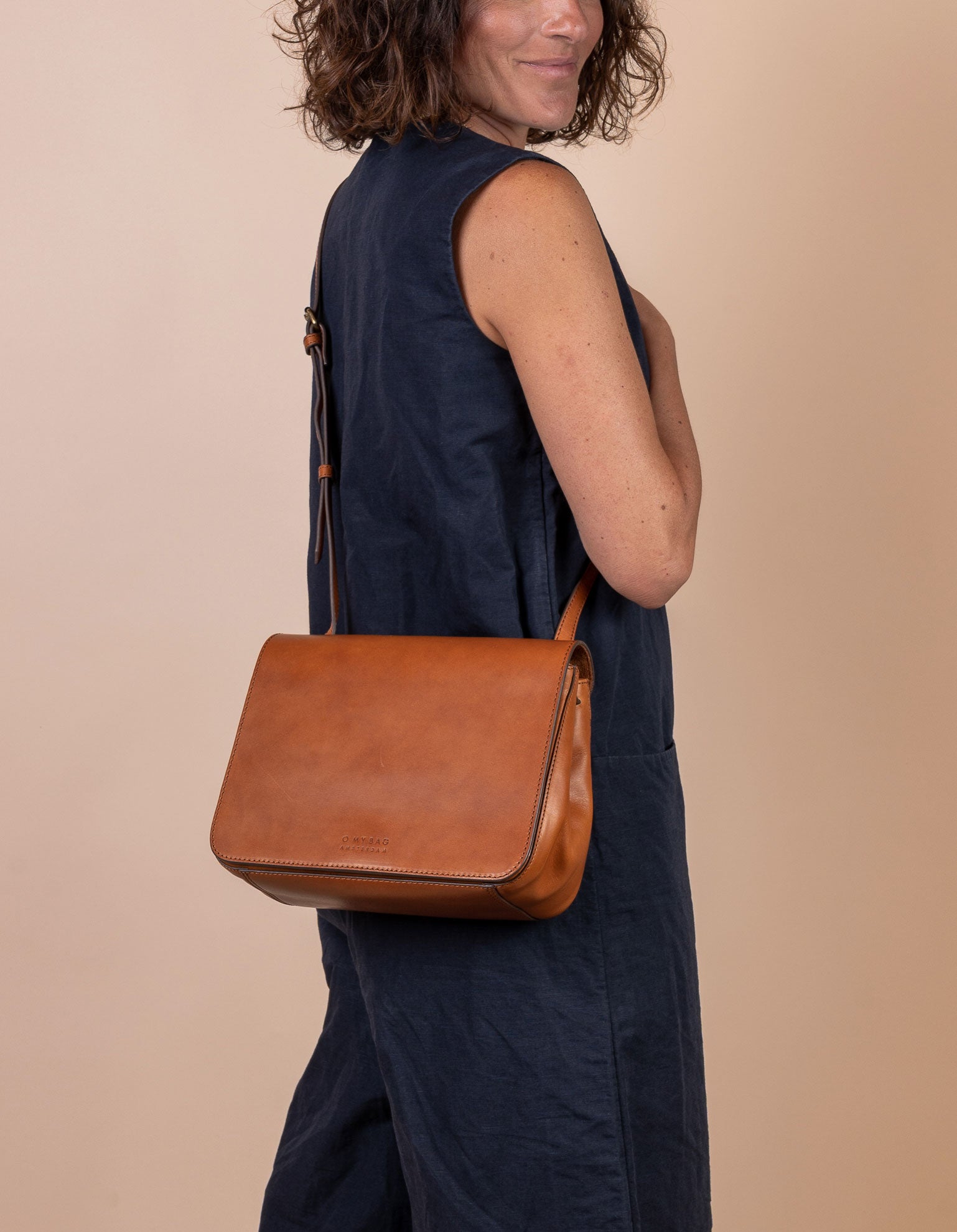 Lucy Cognac Classic Leather Handbag. Model product image.