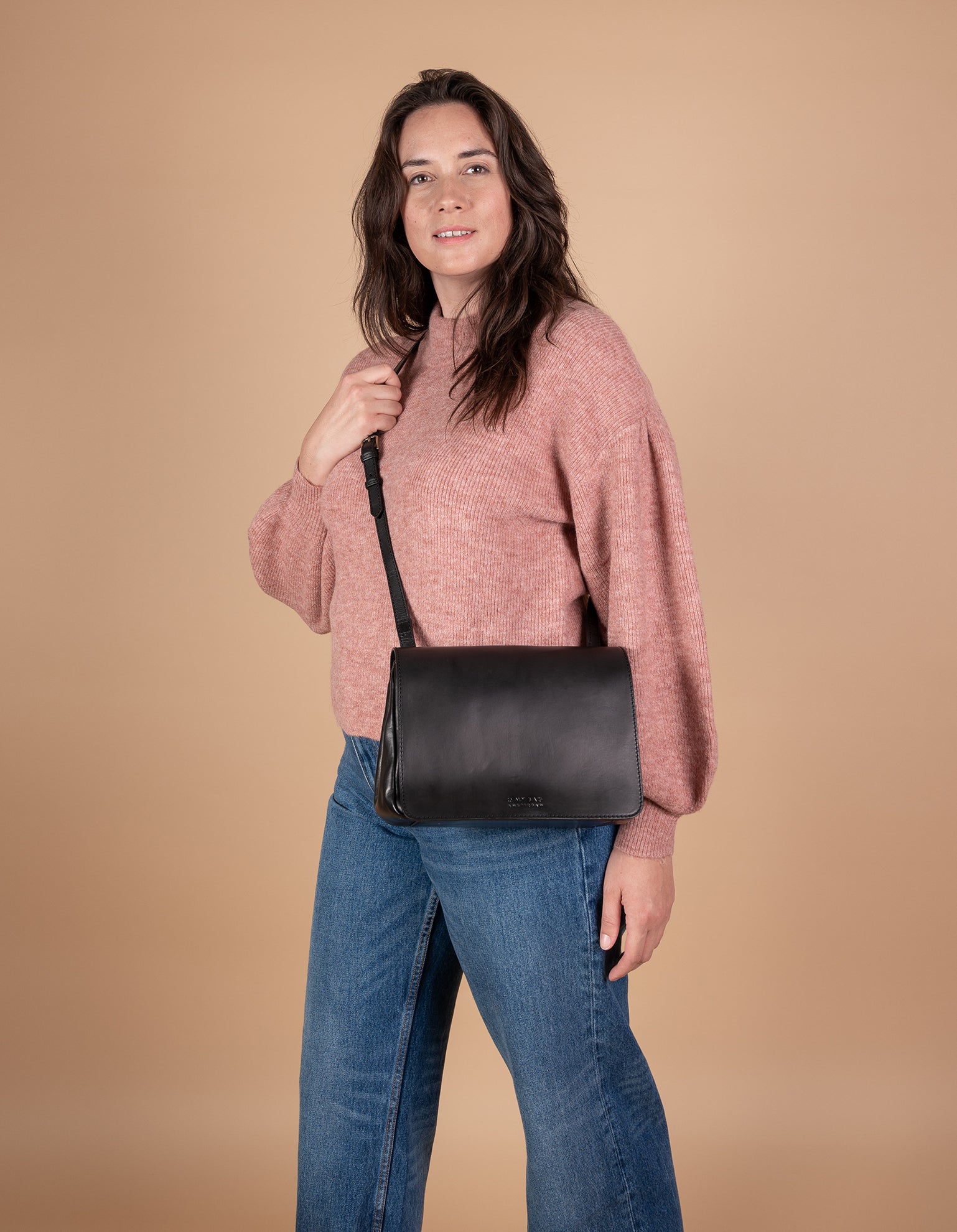 Lucy Black Classic Black Leather Handbag. Model Image.