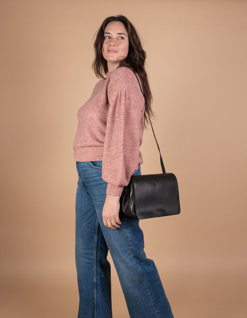 Lucy Black Classic Black Leather Handbag. Model Image