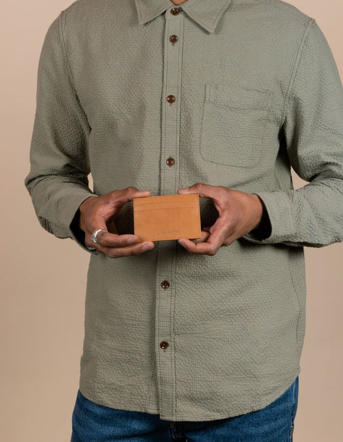 Apple leather card case in cognac - Male model image