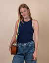 Rainbow webbing strap, female model product image.