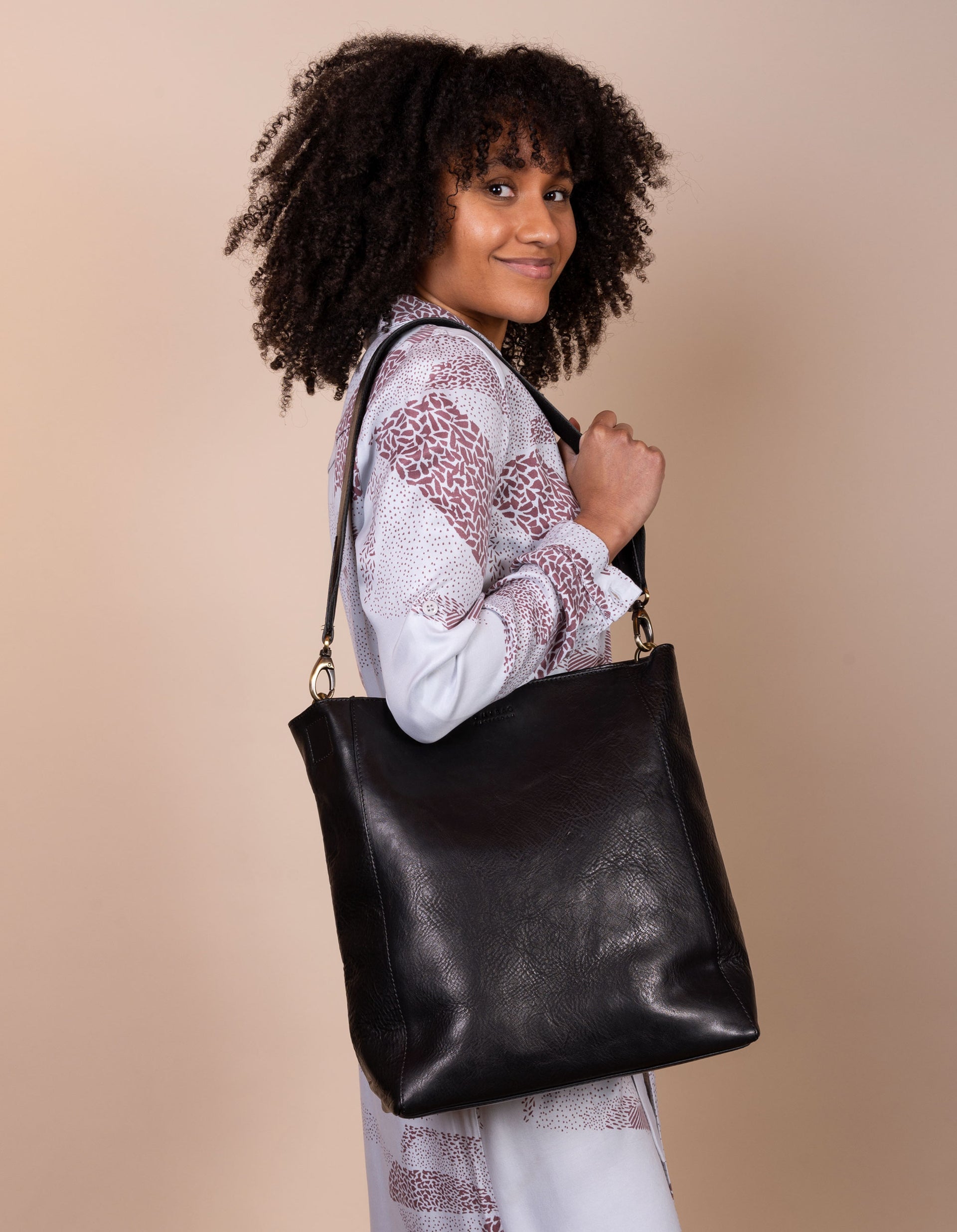 Sofia Black Leather Stromboli Leather - Short strap, female model image