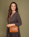 Sue Cognac Classic Croco Leather Handbag. Model Image.